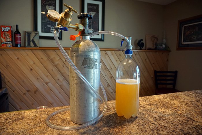 co2 tank connected to a carbonator cap for carbonating cider
