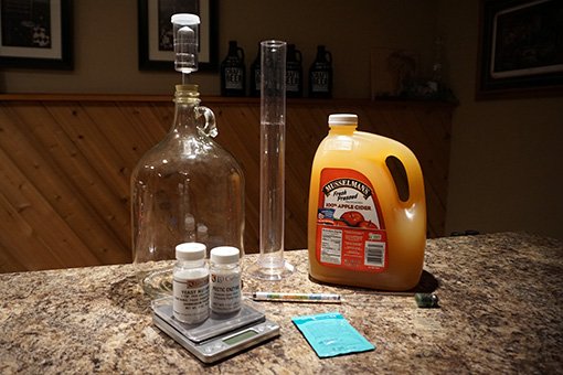 glass carboy and brewing equipment for making hard cider at home