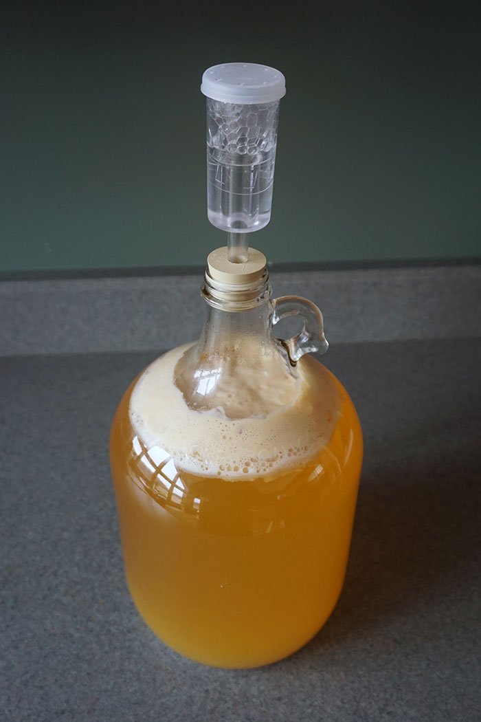 co2 tank connected to a carbonator cap for carbonating cider
