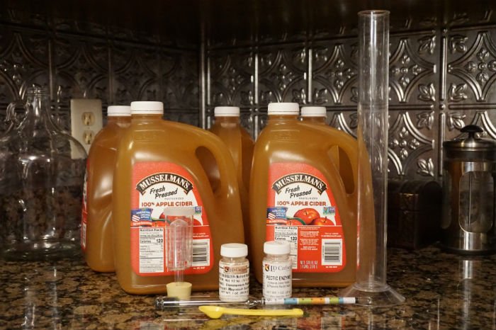 Juice and equipment for making hard cider jugs of apple cider and equipment for making hard cider
