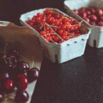 Three baskets of fresh red cherries